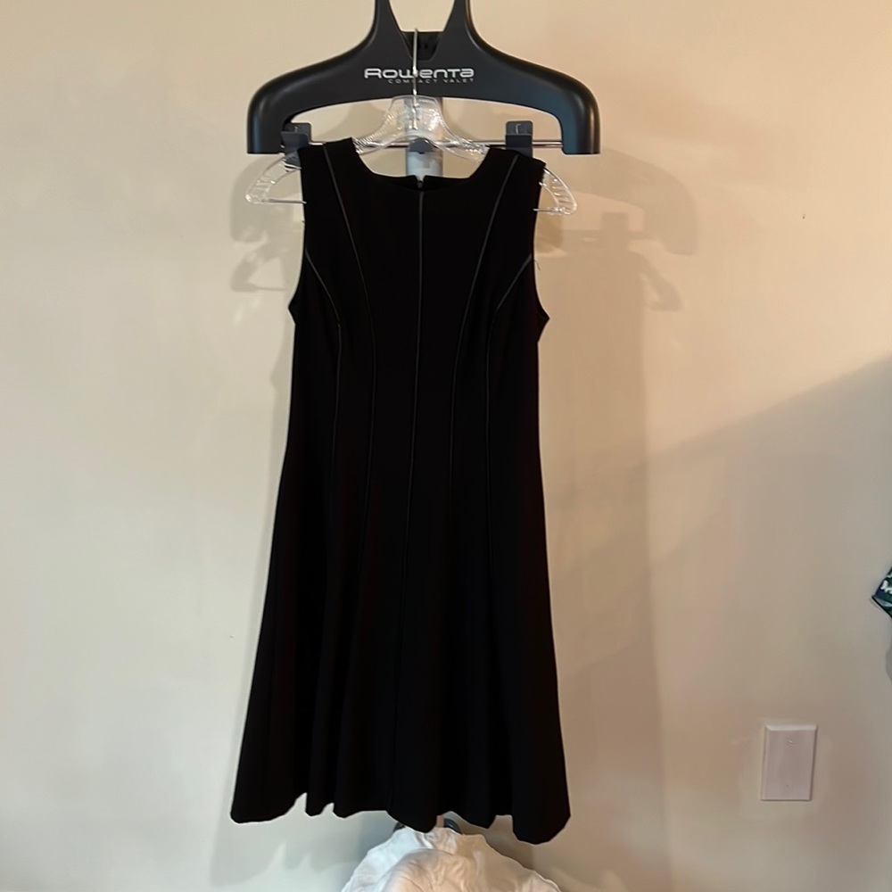 Calvin Klein with leather detail front and back. Black below the knee.